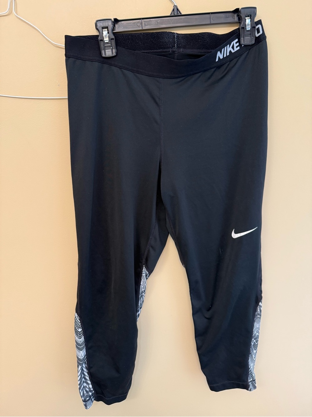 Nike Black Capri Leggings with White Swoosh and Patterned Panels